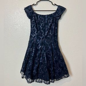 Dark Blue Cocktail Dress with beautiful pattern and sequin detail. Size 8.